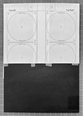 Two template pages taped to the fan panel