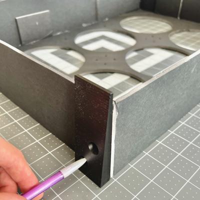 Marking the holes for one of the angled feet.