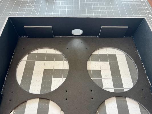 The hole cut out for the telescoping luggage handle.