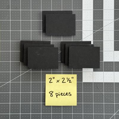 8 filter flange spacers cut from the 2” × 20” foam board piece, each about 2” by 2 ½”.