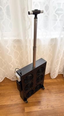 A rolling luggage style build made out of heavy duty, plastic-faced Ultraboard Classic with the telescoping luggage handle extended.