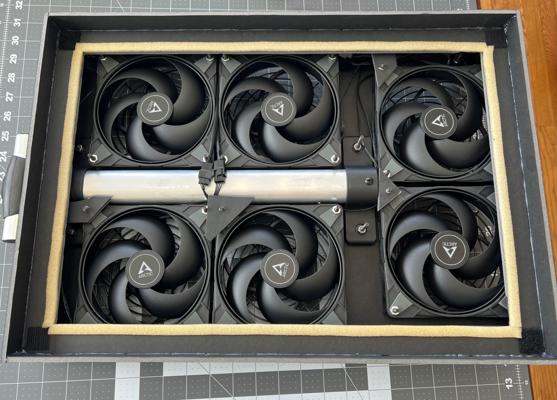 Weather stripping applied to the filter flange on a rolling luggage style build.